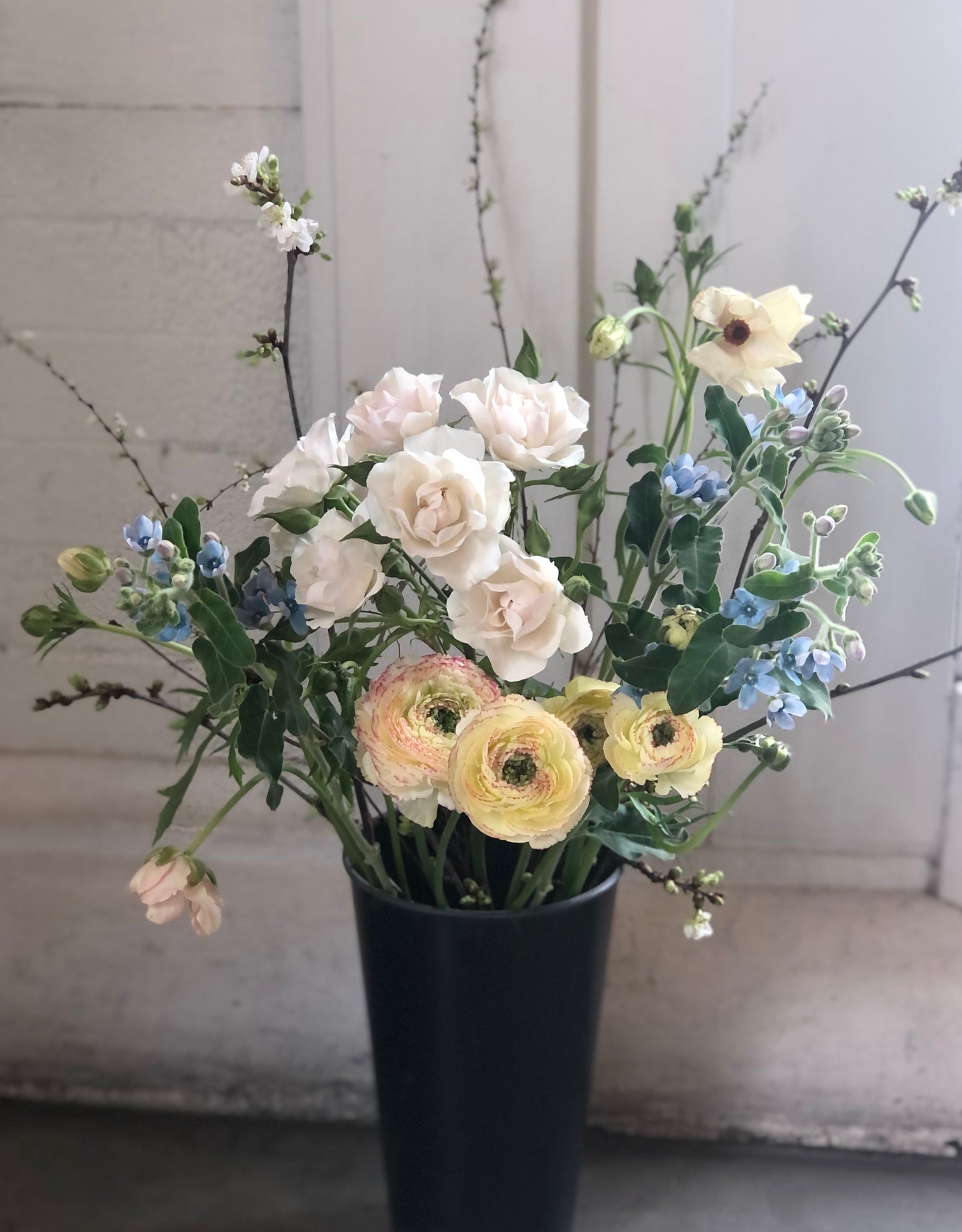 A Bucket Of Flowers To Arrange At Home