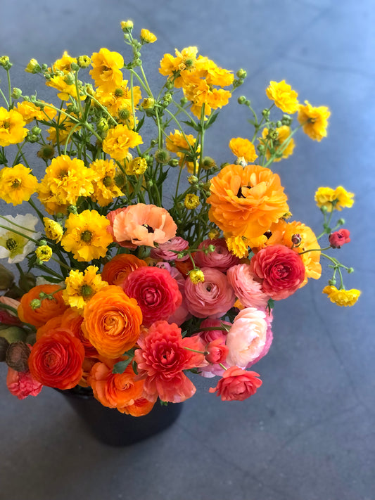 A Bucket Of Flowers To Arrange At Home